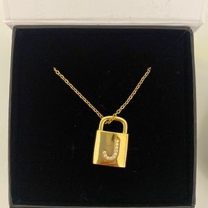 Gold J locket necklace never worn still in box